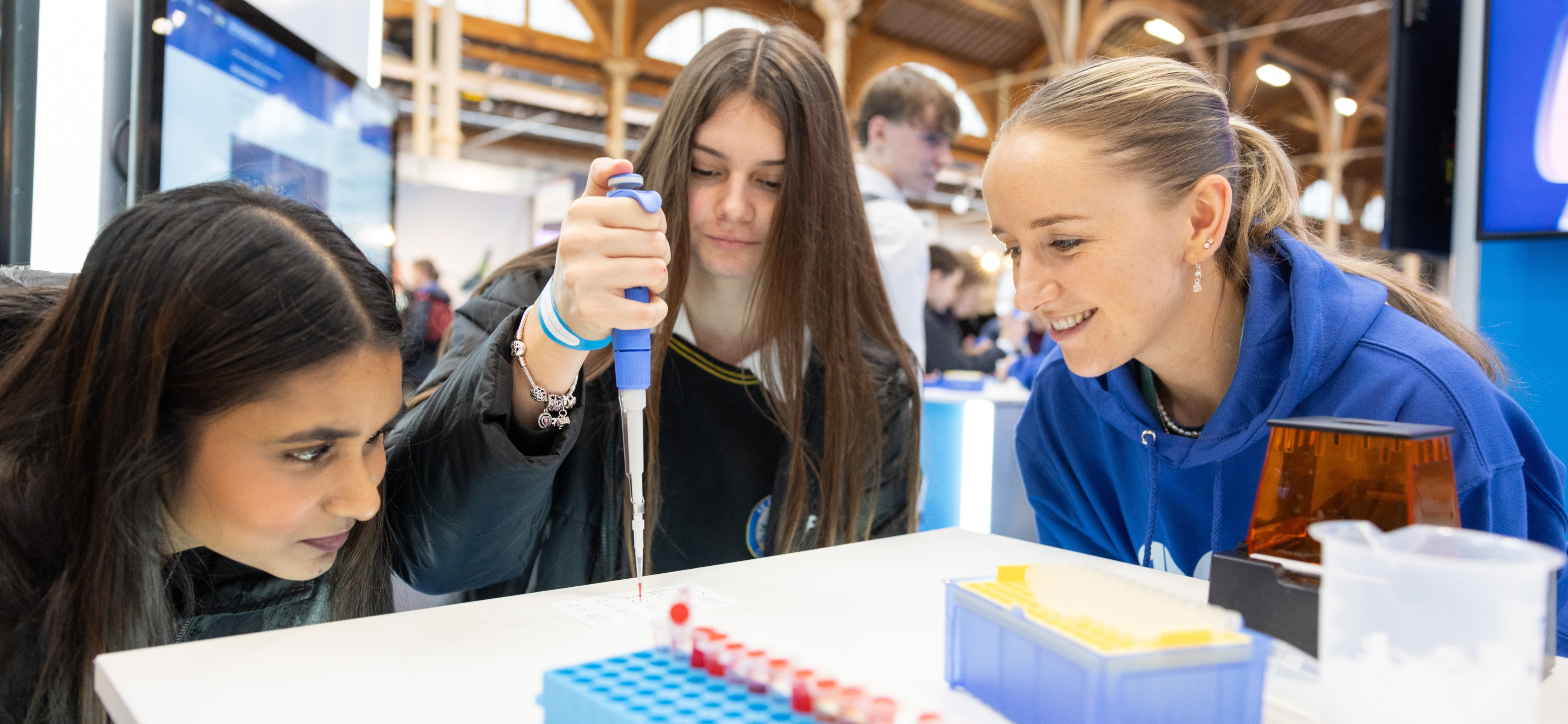 Students from St Laurence College learn how to micro pipette at the Amgen Foundation Stand at the Stripe Young Scientist and Technology Exhibition 2026.
